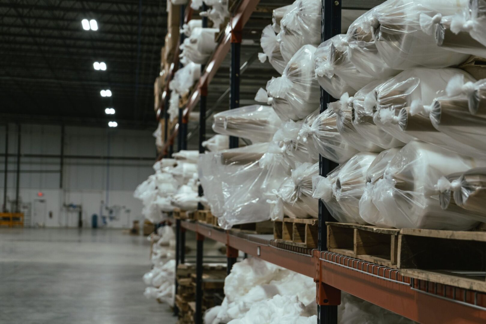 A warehouse filled with lots of white bags.