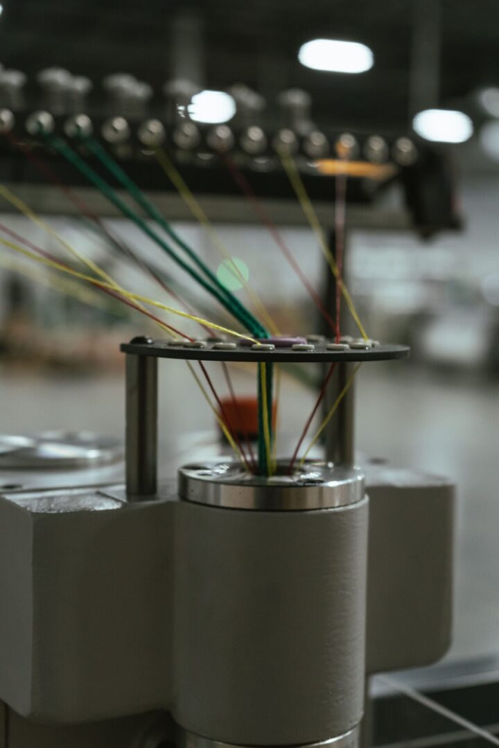 A close up of some wires on a machine