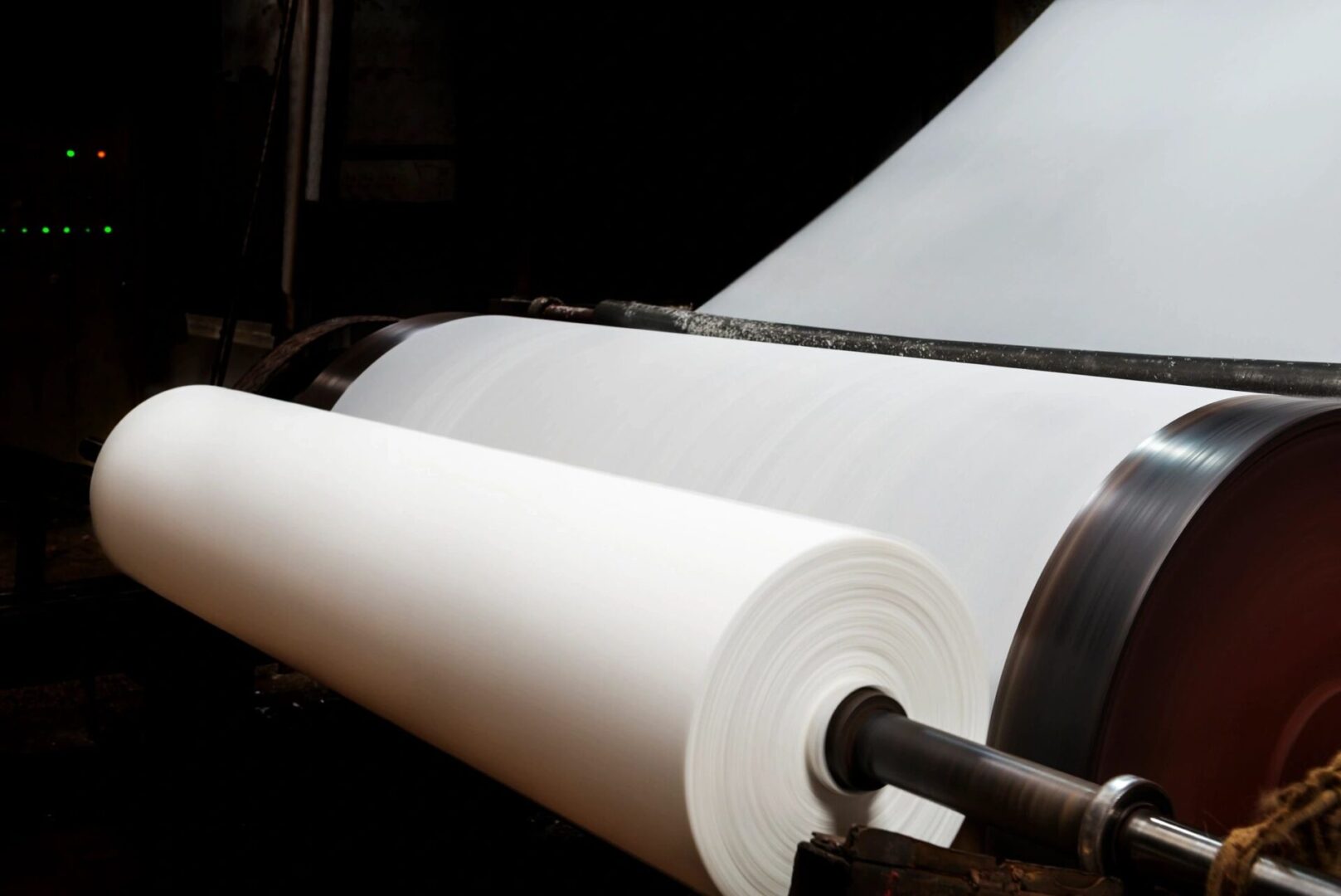 A roll of paper is being rolled up.